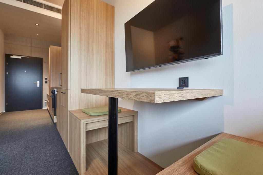 TV a/nebo společenská místnost v ubytování miniLOFT apartments Leonding 24 hours