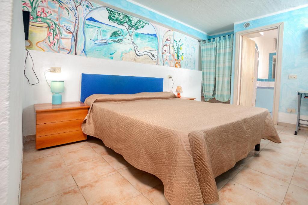 Postel nebo postele na pokoji v ubytování Locanda Domus De Vida