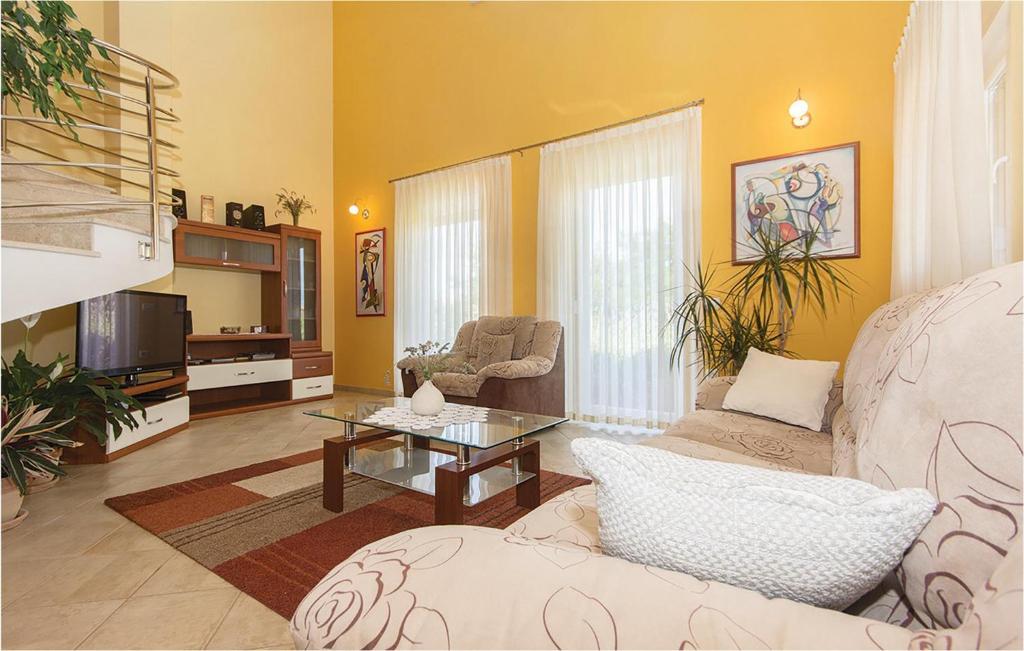 Telewizja i/lub zestaw kina domowego w obiekcie Holiday Home Volme