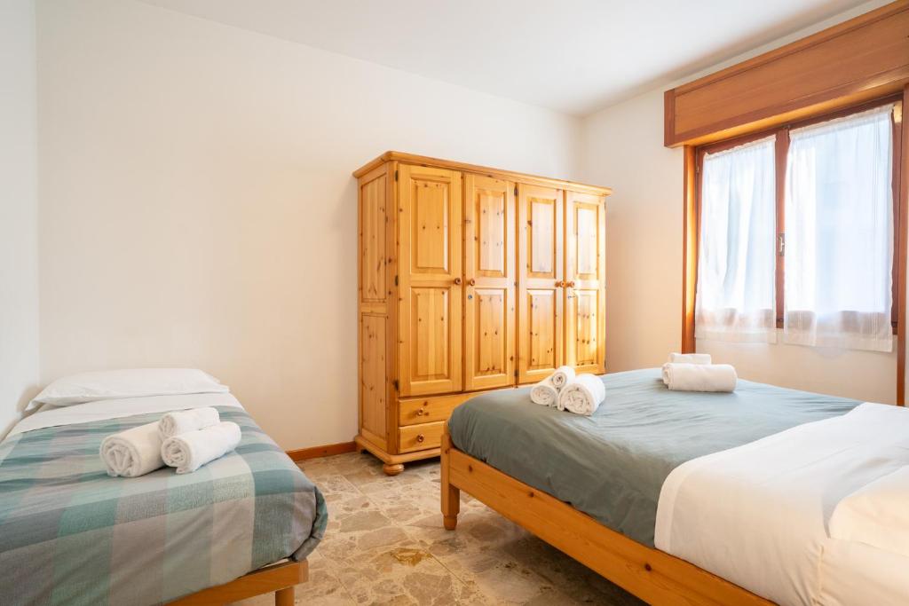 Postel nebo postele na pokoji v ubytování Bellavista - Residence in Barzio center near free ski shuttle
