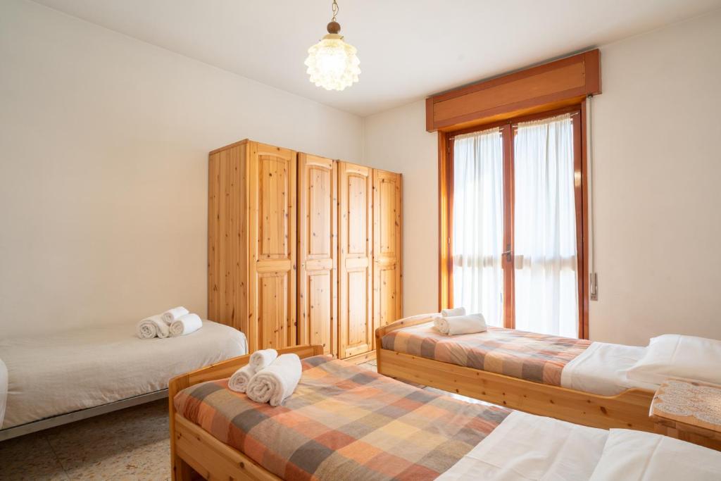 Postel nebo postele na pokoji v ubytování Bellavista - Residence in Barzio center near free ski shuttle