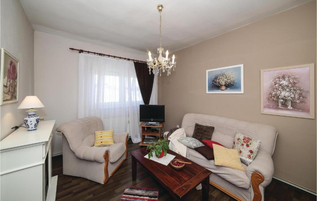 Televízia a/alebo spoločenská miestnosť v ubytovaní Apartment Obala Spanja Roka Cr
