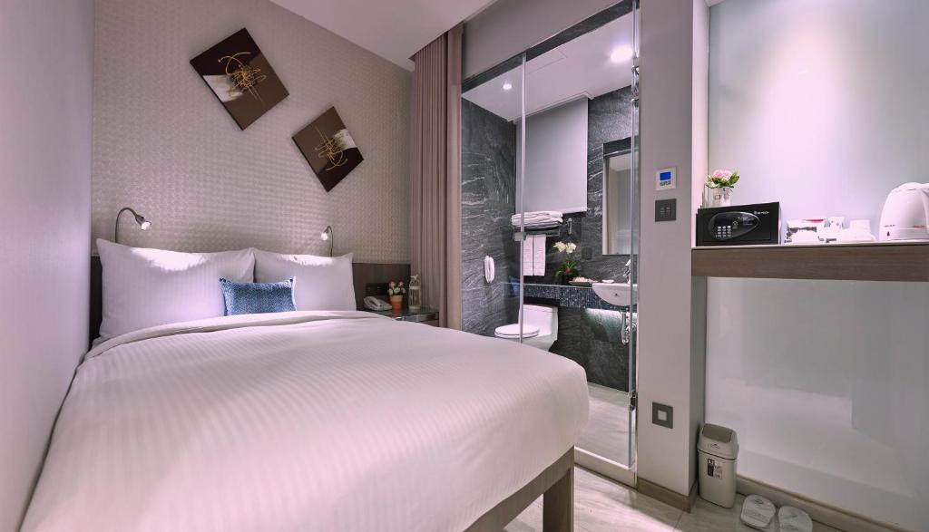 Postel nebo postele na pokoji v ubytování Beauty Hotels Taipei - B7 Journey
