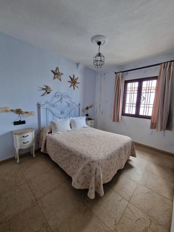 Cama o camas de una habitación en Hospedería El Caravansar
