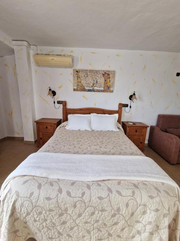 Cama o camas de una habitación en Hospedería El Caravansar