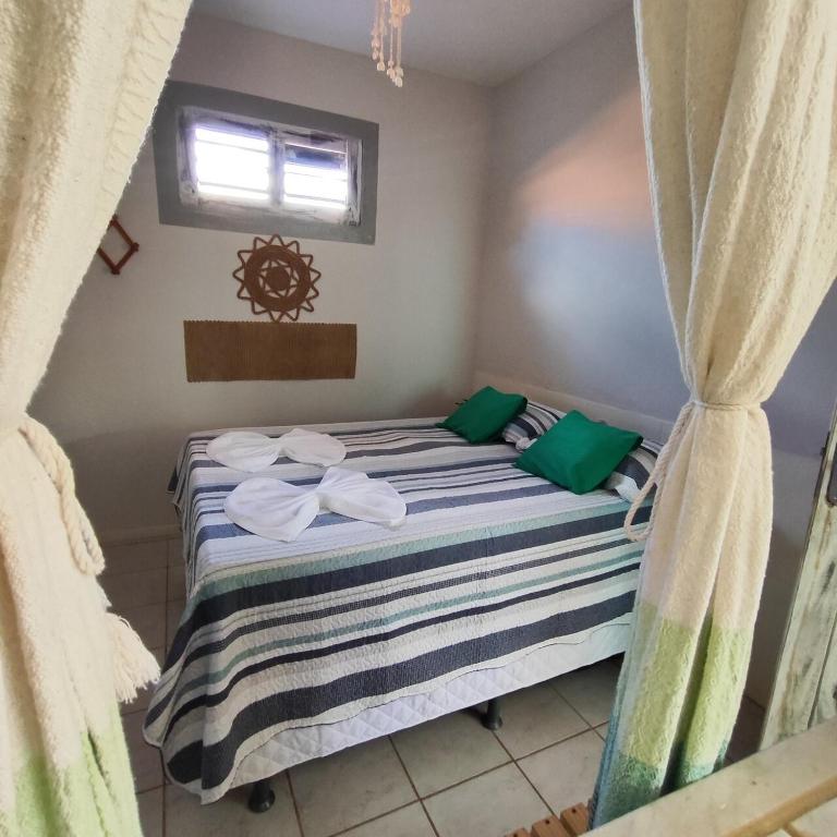 Postel nebo postele na pokoji v ubytování Hospedaria Mandacaru