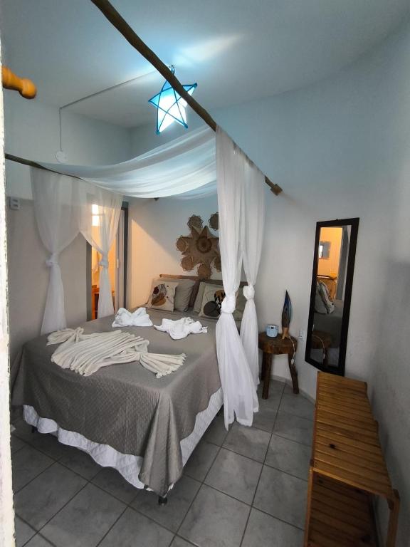 Postel nebo postele na pokoji v ubytování Hospedaria Mandacaru