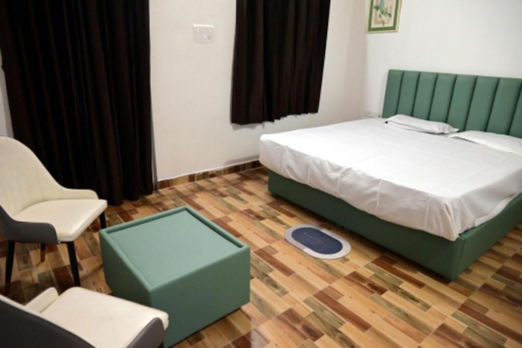 Postel nebo postele na pokoji v ubytování Stone Yard Resort