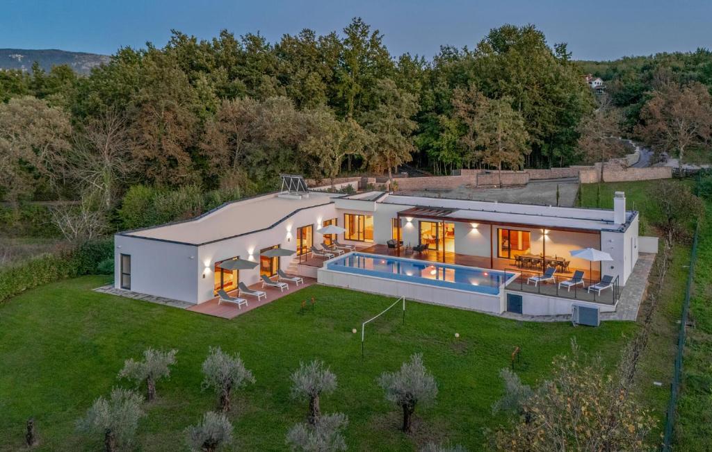 an aerial view of a house with a swimming pool at Villa Istria Green in Kršan