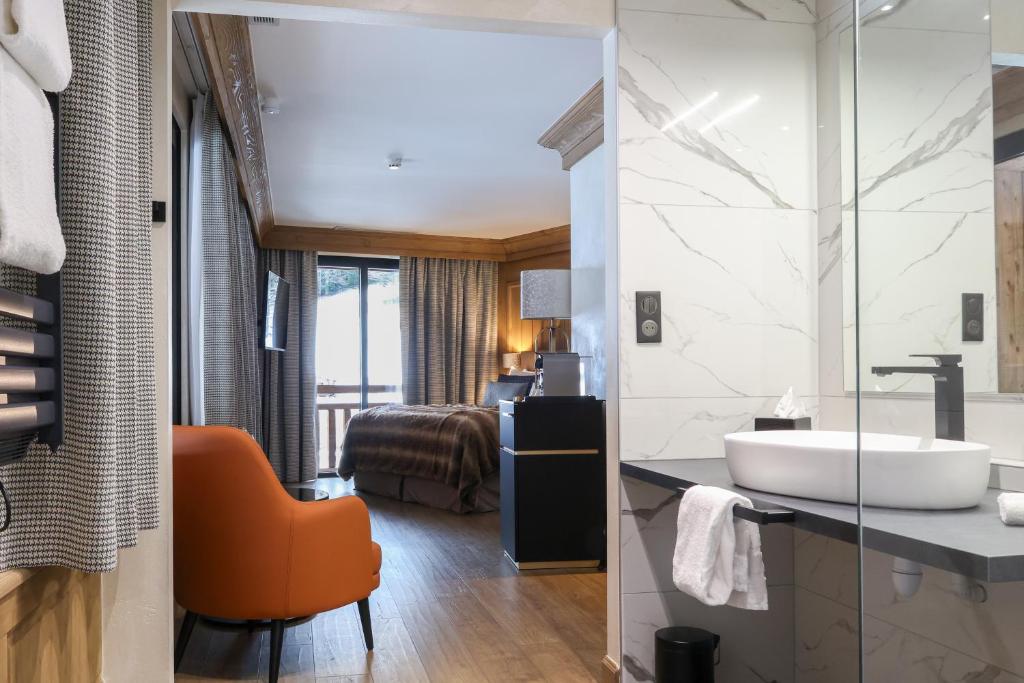 Domaine de Montagne - Hôtel Chalet Frère Josephにあるベッド
