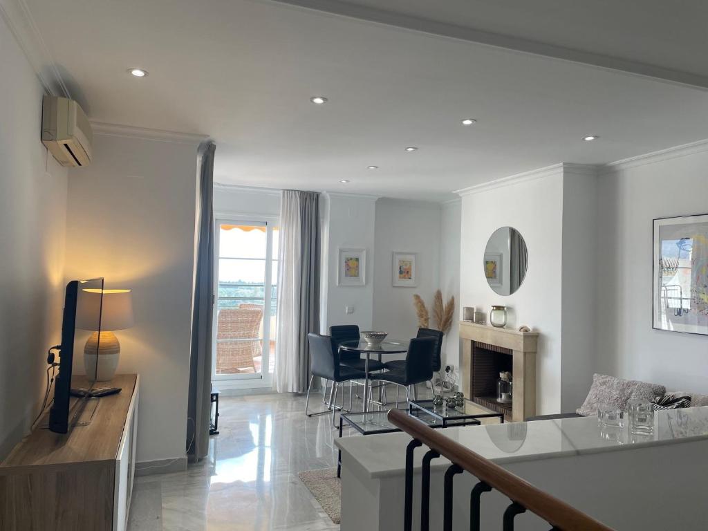 A television and/or entertainment centre at Walking distance to Puerto Banus sea view Apartment