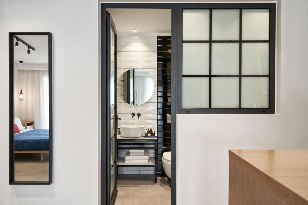 Postel nebo postele na pokoji v ubytování Cozy Suites Potos