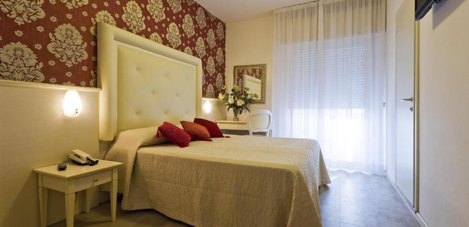 Postel nebo postele na pokoji v ubytování Hotel Foschi-Peninsula