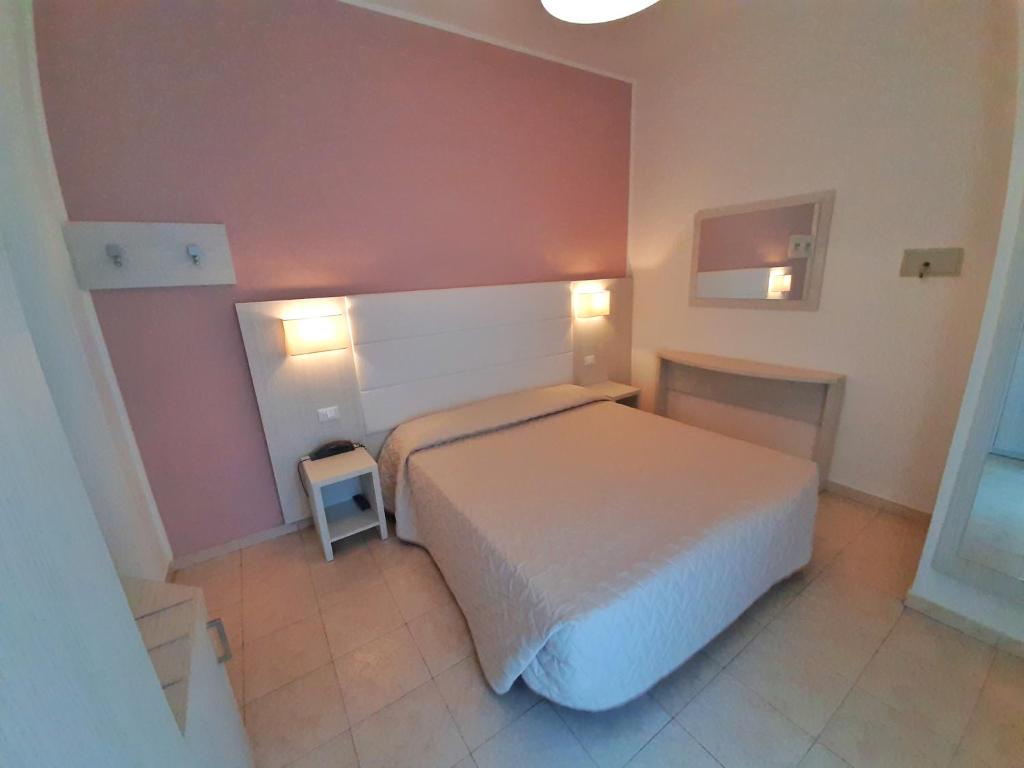 Postel nebo postele na pokoji v ubytování Hotel Foschi-Peninsula