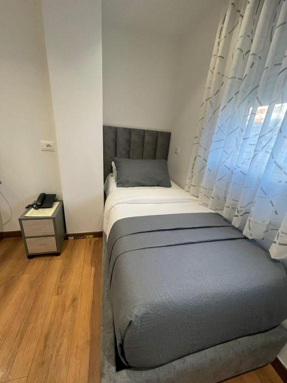 Postel nebo postele na pokoji v ubytování Peaky Hotel