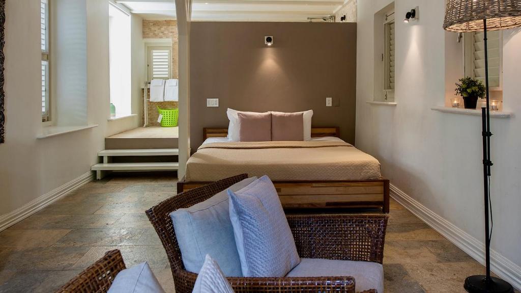 Uma cama ou camas num quarto em Pietermaai Boutique Hotel