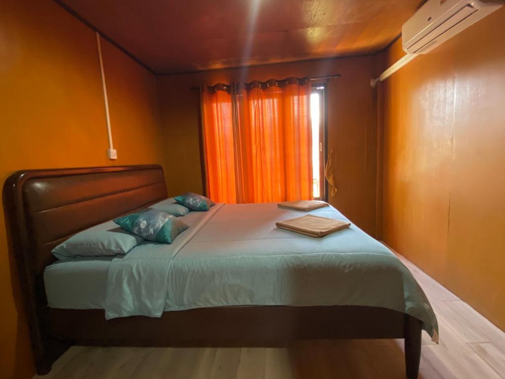 Postel nebo postele na pokoji v ubytování Patcharin Homestay