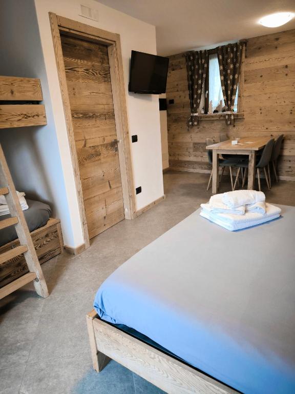 Postel nebo postele na pokoji v ubytování Atelier della Montagna