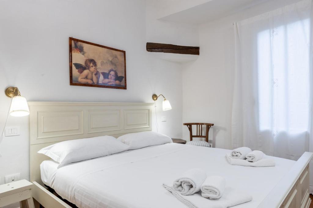 Posteľ alebo postele v izbe v ubytovaní Bargello Apartment