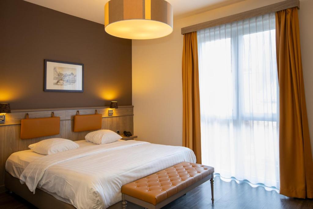 Postel nebo postele na pokoji v ubytování Blanckthys Hotel Voeren