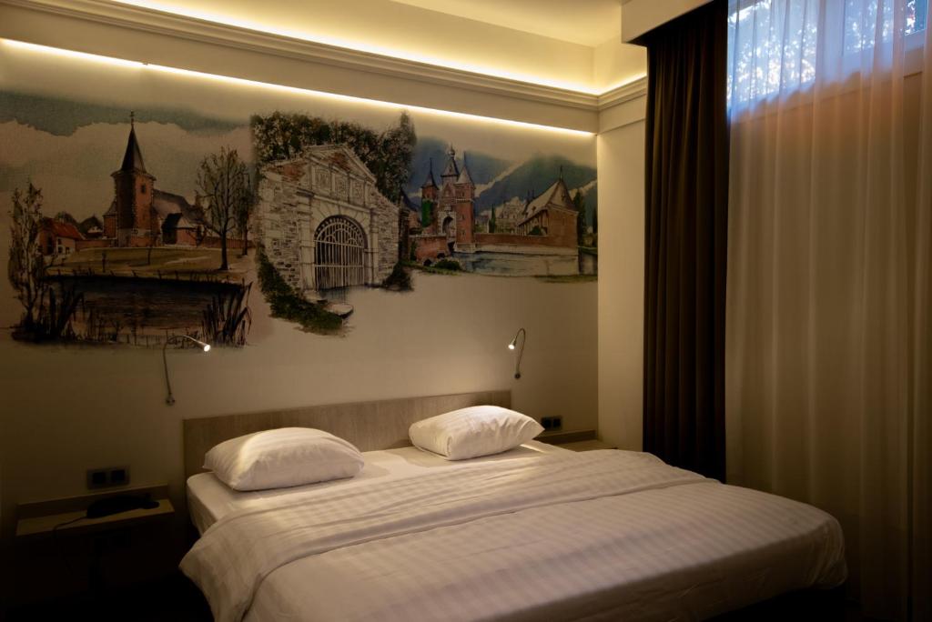 Postel nebo postele na pokoji v ubytování Blanckthys Hotel Voeren