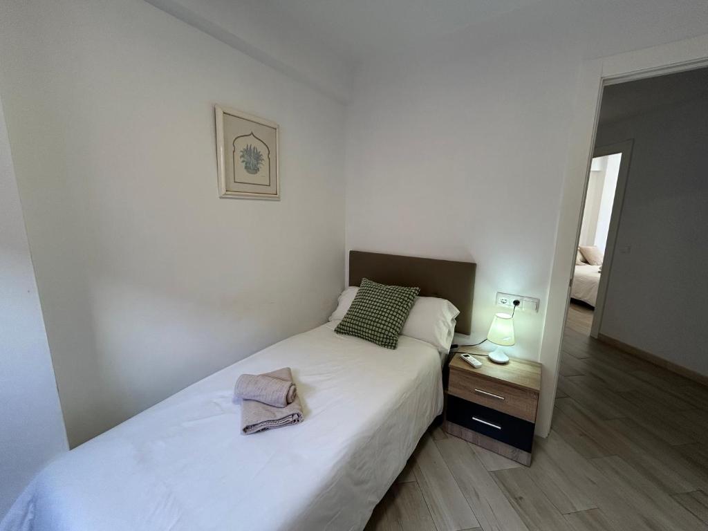 Posteľ alebo postele v izbe v ubytovaní Adoorable Malaga Center