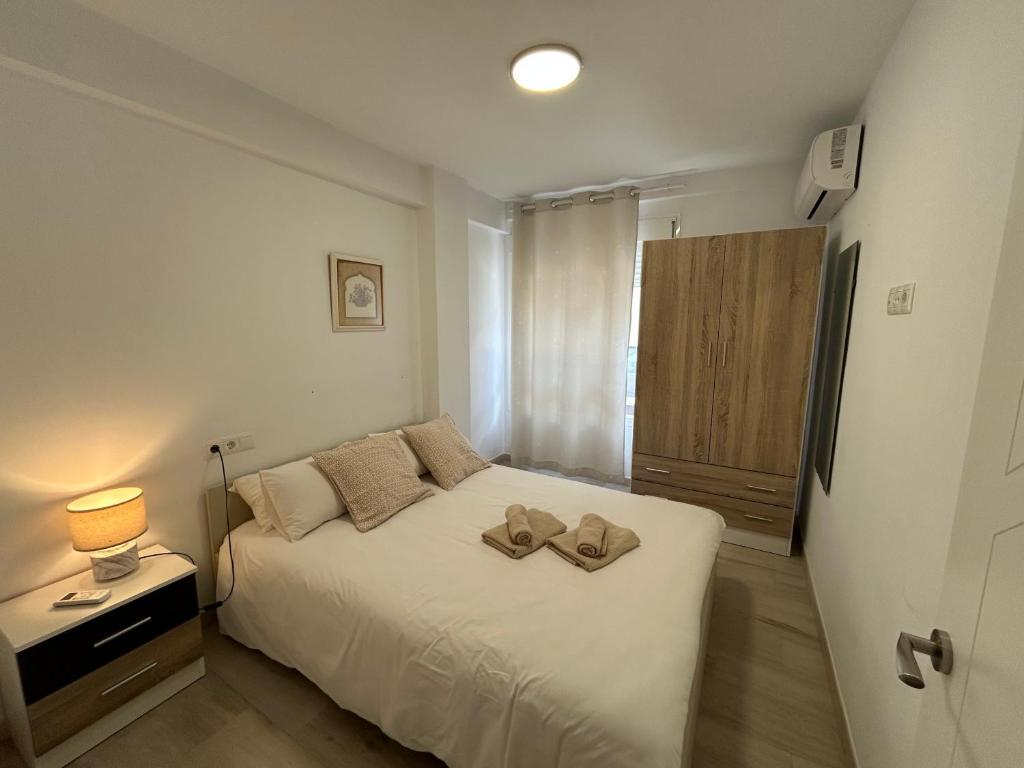 Posteľ alebo postele v izbe v ubytovaní Adoorable Malaga Center