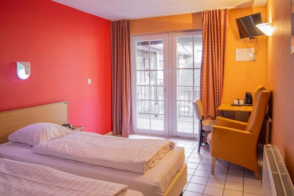 Postel nebo postele na pokoji v ubytování Blanckthys Hotel Voeren