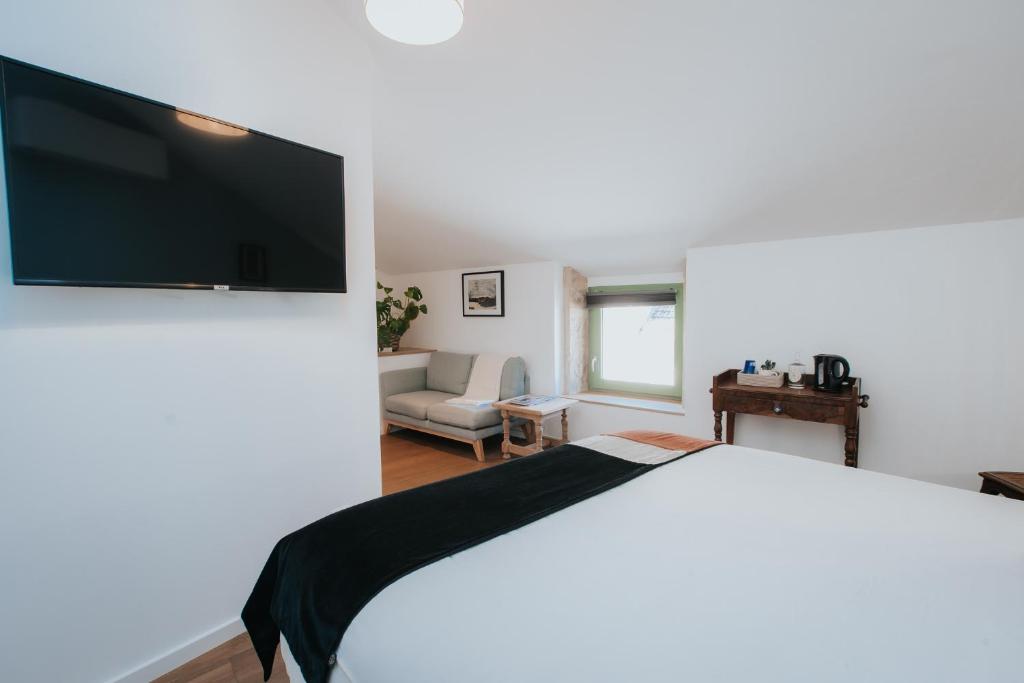 Postel nebo postele na pokoji v ubytování Maison Tassigny
