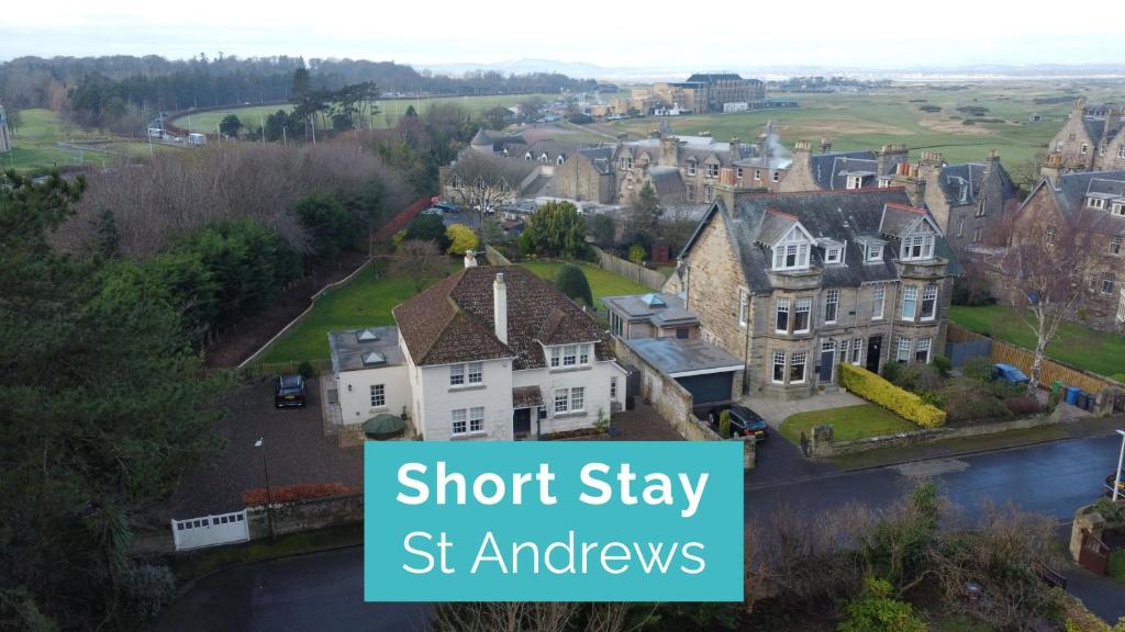 a picture of a house with the words short stay st amyris at The Windmill Room - 1 min to Old Course in St. Andrews