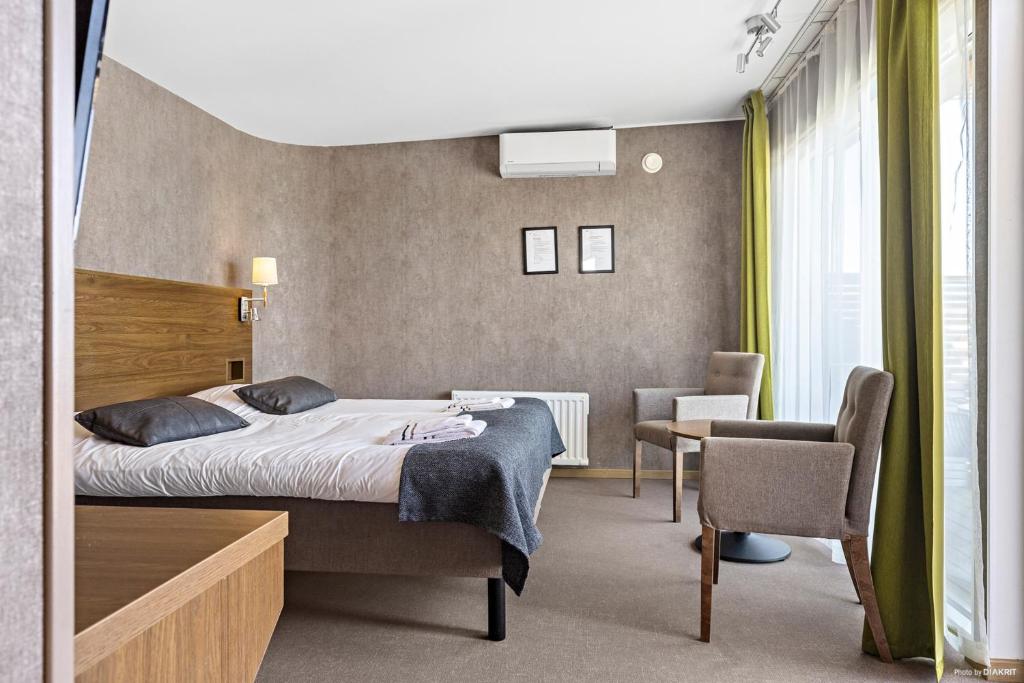 Postel nebo postele na pokoji v ubytování First Camp City-Strömstad