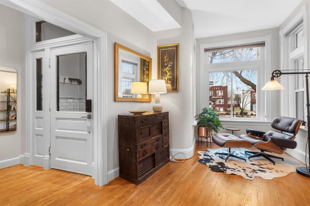 a living room with a chair and a table at Spacious and Central DC 3-BR Getaway Close to It All in Washington, D.C.