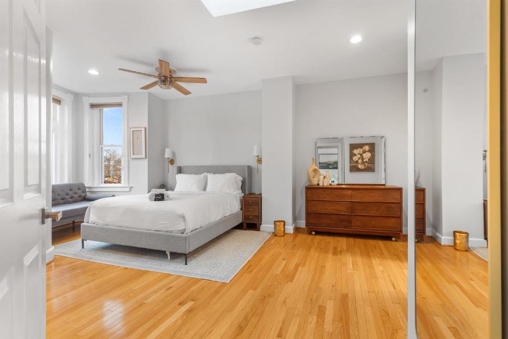 a bedroom with a bed and a ceiling fan at Spacious and Central DC 3-BR Getaway Close to It All in Washington, D.C.