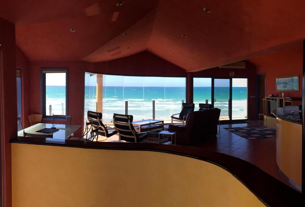 a living room with a view of the ocean at The Penthouse in Port Fairy