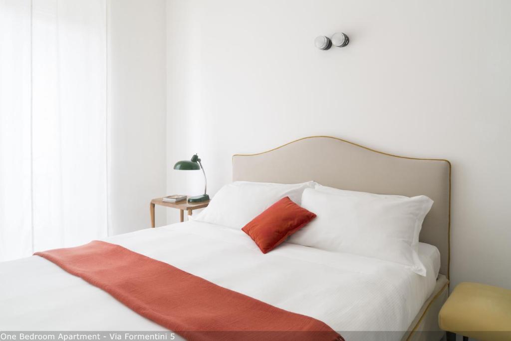 Łóżko lub łóżka w pokoju w obiekcie Brera Apartments