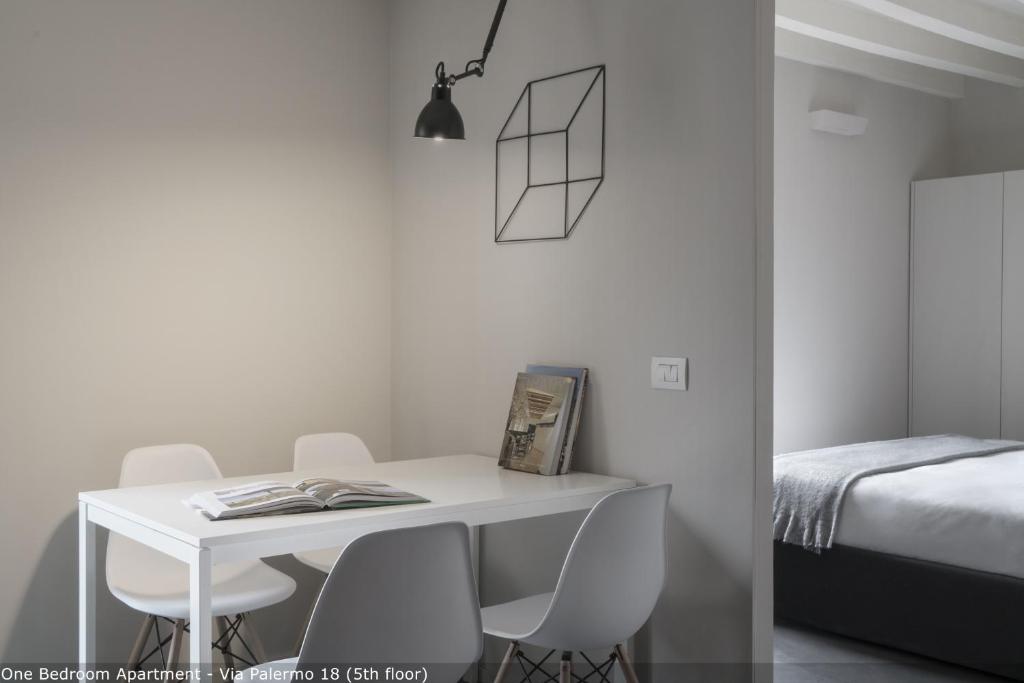 Łóżko lub łóżka w pokoju w obiekcie Brera Apartments