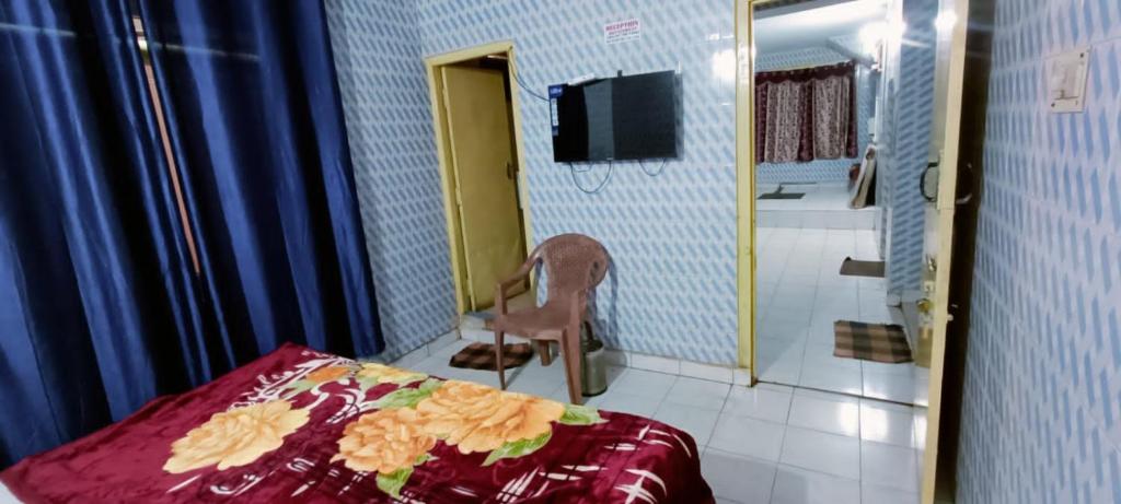 Postel nebo postele na pokoji v ubytování Mananyaa Residency
