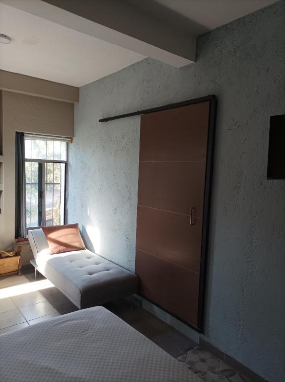 Voodi või voodid majutusasutuse Habitaciones Dos Antonios toas