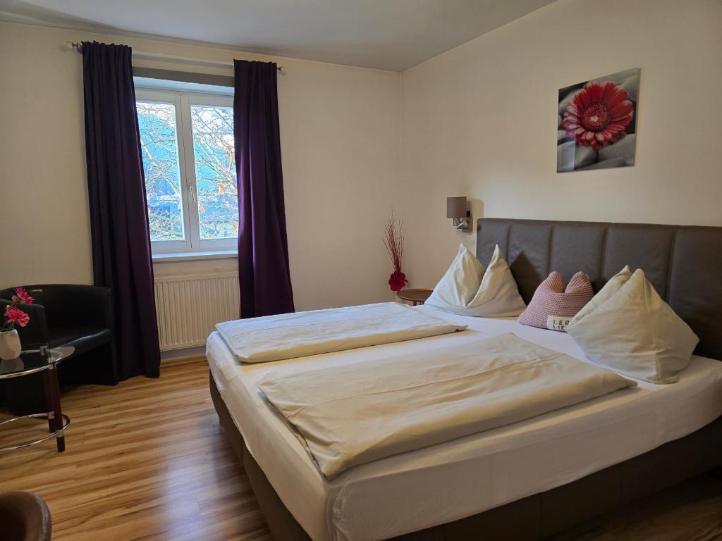 Postel nebo postele na pokoji v ubytování Hotel Hafnerwirt