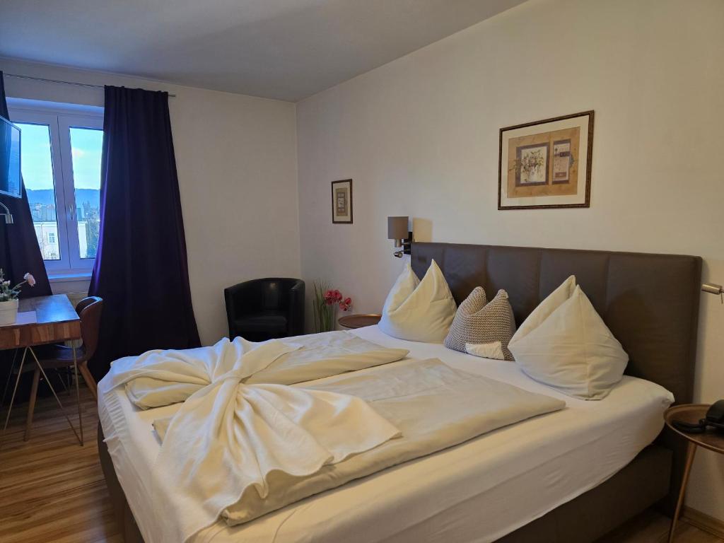Postel nebo postele na pokoji v ubytování Hotel Hafnerwirt