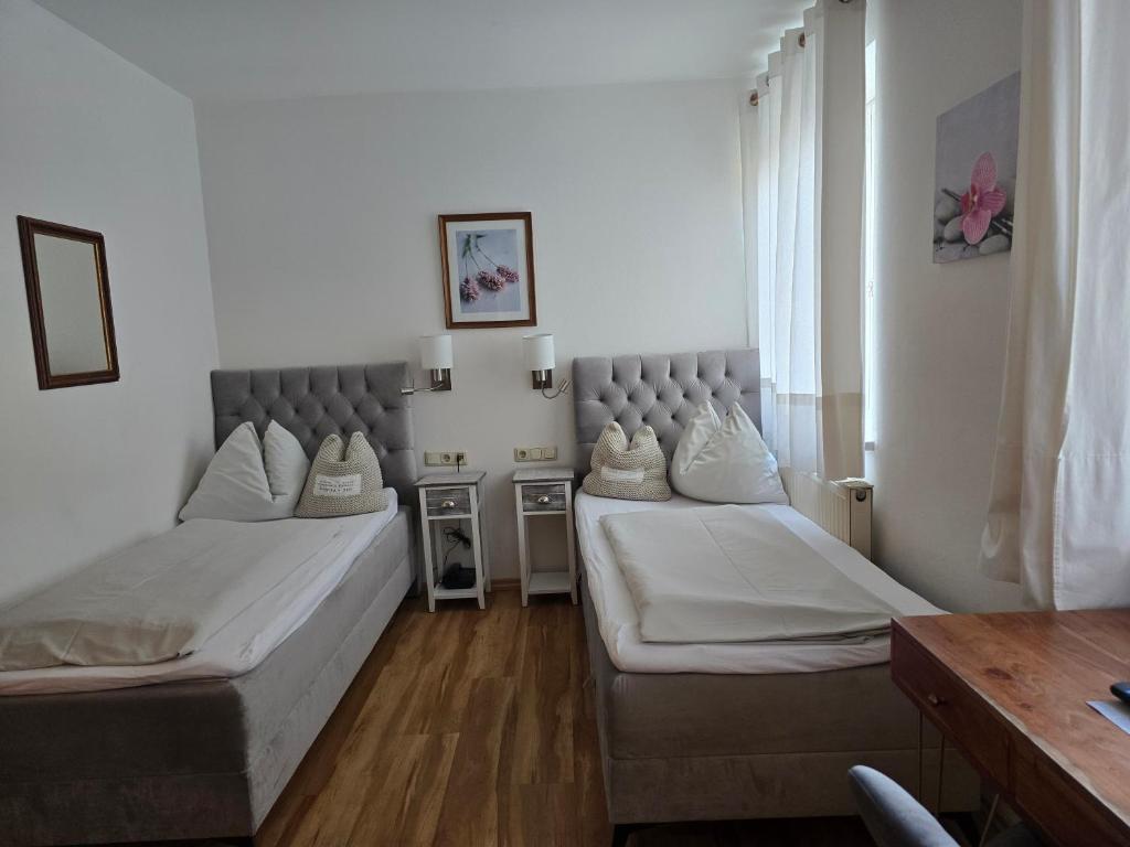 Postel nebo postele na pokoji v ubytování Hotel Hafnerwirt