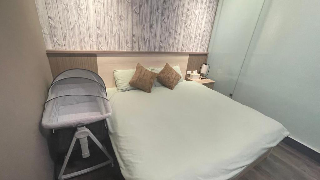 Postel nebo postele na pokoji v ubytování 鄉間小路 Home 備有專屬停車場