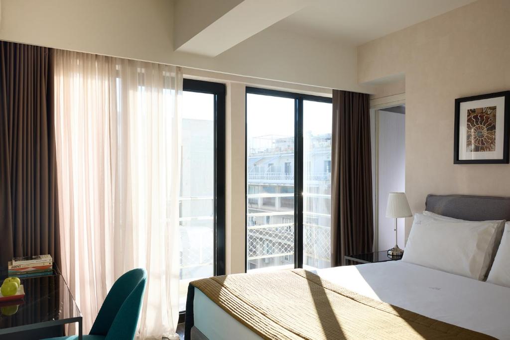Posteľ alebo postele v izbe v ubytovaní Astor Hotel Athens