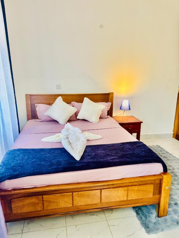 Postel nebo postele na pokoji v ubytování Seriani homes Diani