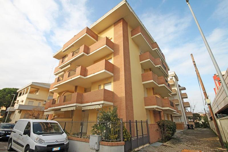 a car parked in front of a building at Soffio di mare in Alba Adriatica