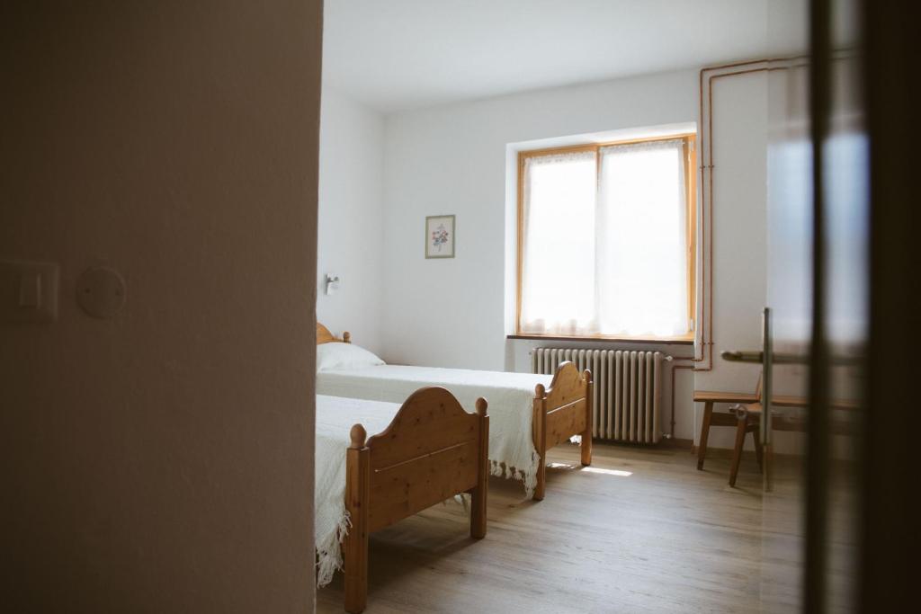 Posteľ alebo postele v izbe v ubytovaní Agritur Rizzi di Inama Ugo