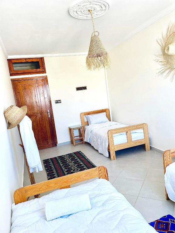 Postel nebo postele na pokoji v ubytování Waveside Hostel