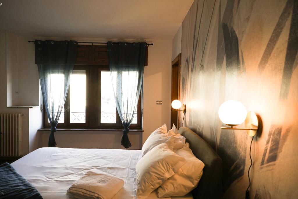 Postel nebo postele na pokoji v ubytování Clos du Pinot by Hili