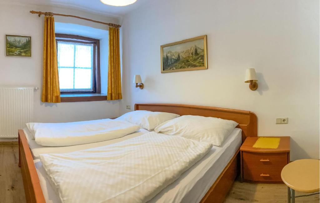 A bed or beds in a room at Ferienwohnung In Rauris