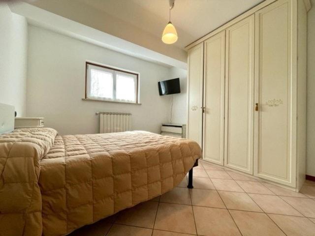 Postel nebo postele na pokoji v ubytování Residenza Roncuzzi